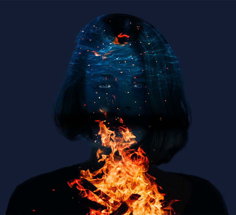 three images of a girl, night sky and fire are combined into one image. adobe photoshop