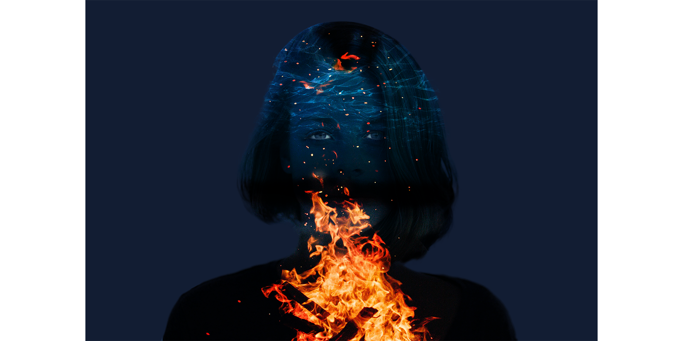 three images of a girl, night sky and fire are combined into one image. adobe photoshop